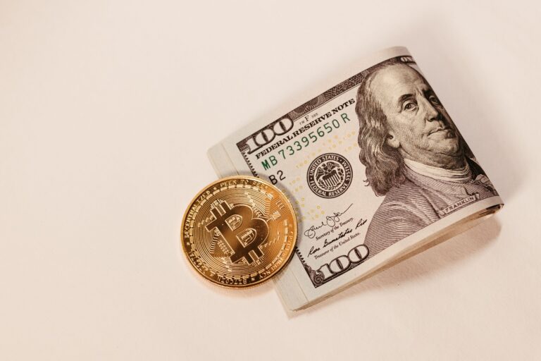 Bitcoin coin with US dollar bill